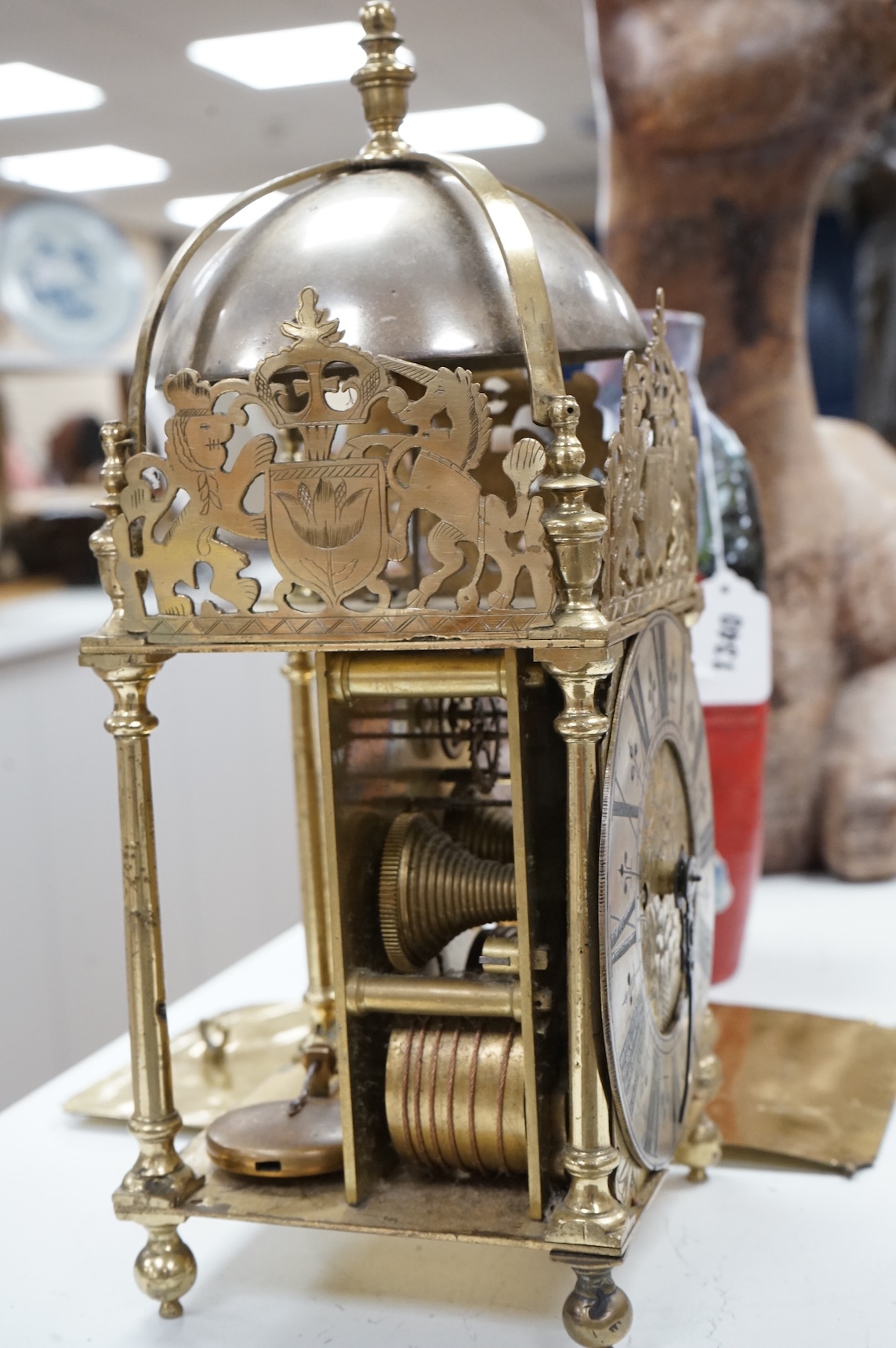 A twin fusee brass lantern clock, 38cm high.